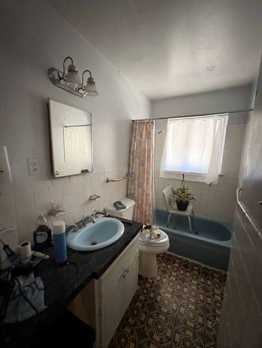 Dated bathroom inside a Colorado home purchased as-is
